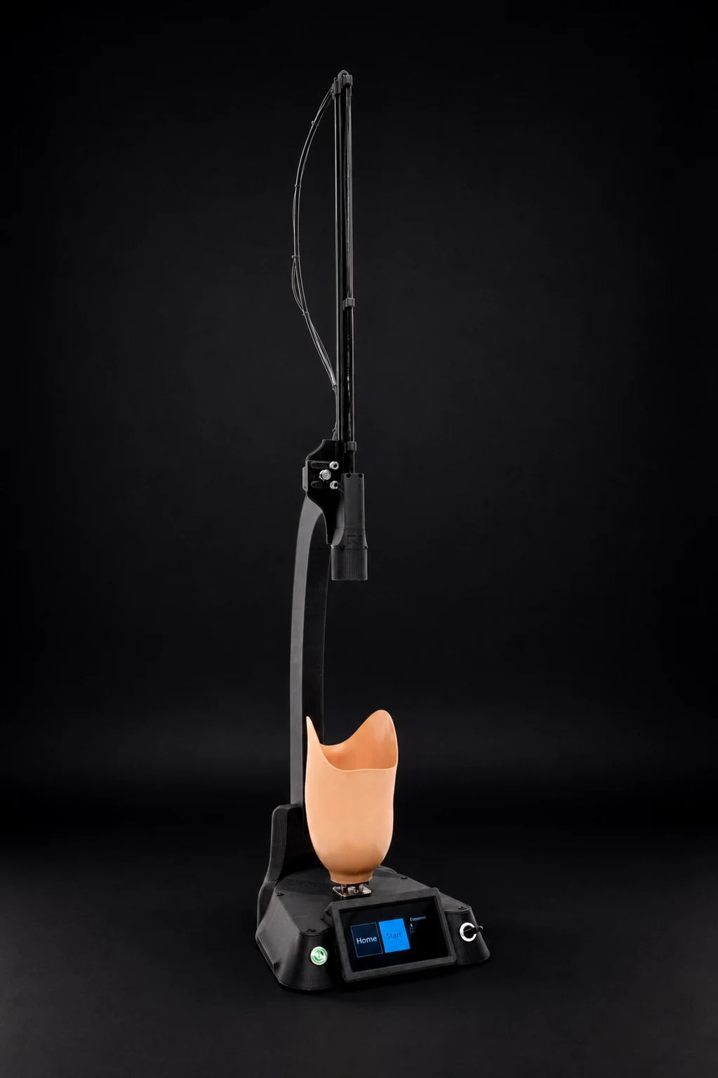 Full Noura scanner with an orange prosthetic socket mounted between the turntable and scan head in a dark studio